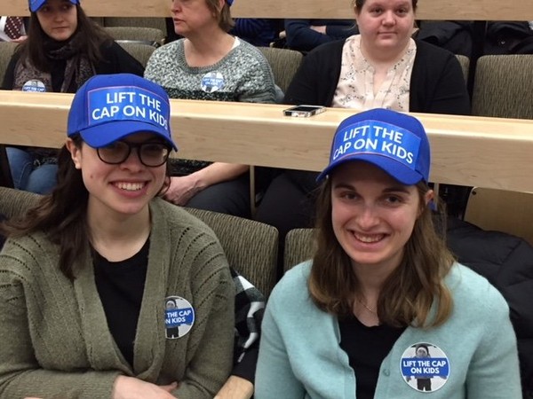 Advocates for the "Lift the Cap on Kids" campaign attend a Statehouse budget hearing on March 16, 2018.