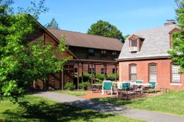 An expansive outdoor brick patio beside the Technology Center dormitories has tables for people to eat, relax and enjoy the outdoors.