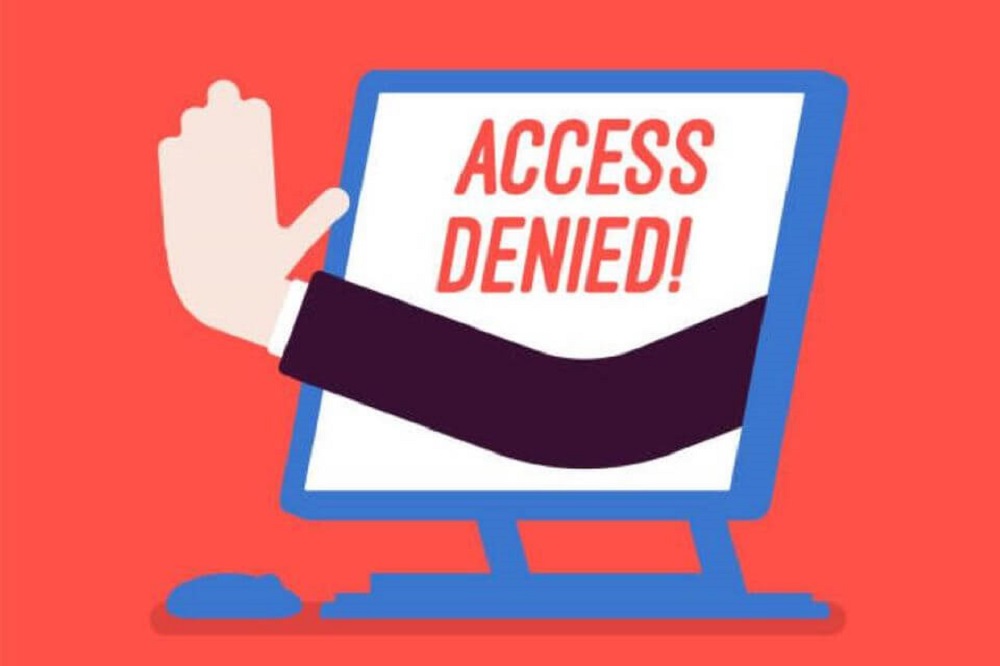 A cartoon hand pokes out from a computer monitor with the words "Access Denied" on the screen. This illustrates the effects of inaccessible technology on those whom it excludes.
