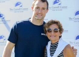Rosellen Sullivan poses with a New England Patriots player at a past Walk for Independence.