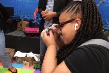 a girl smiling during the field trip to Olin College