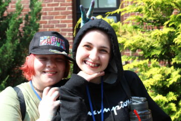 2 girls smiling outside