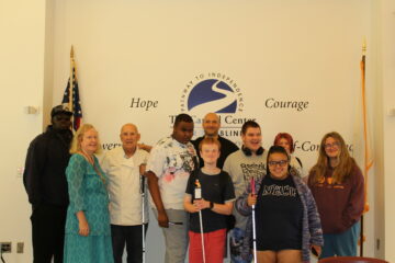 7 students and an instructor smiling for a group picture with Chef Joe Murphy and his expert assistant, Chef Joe